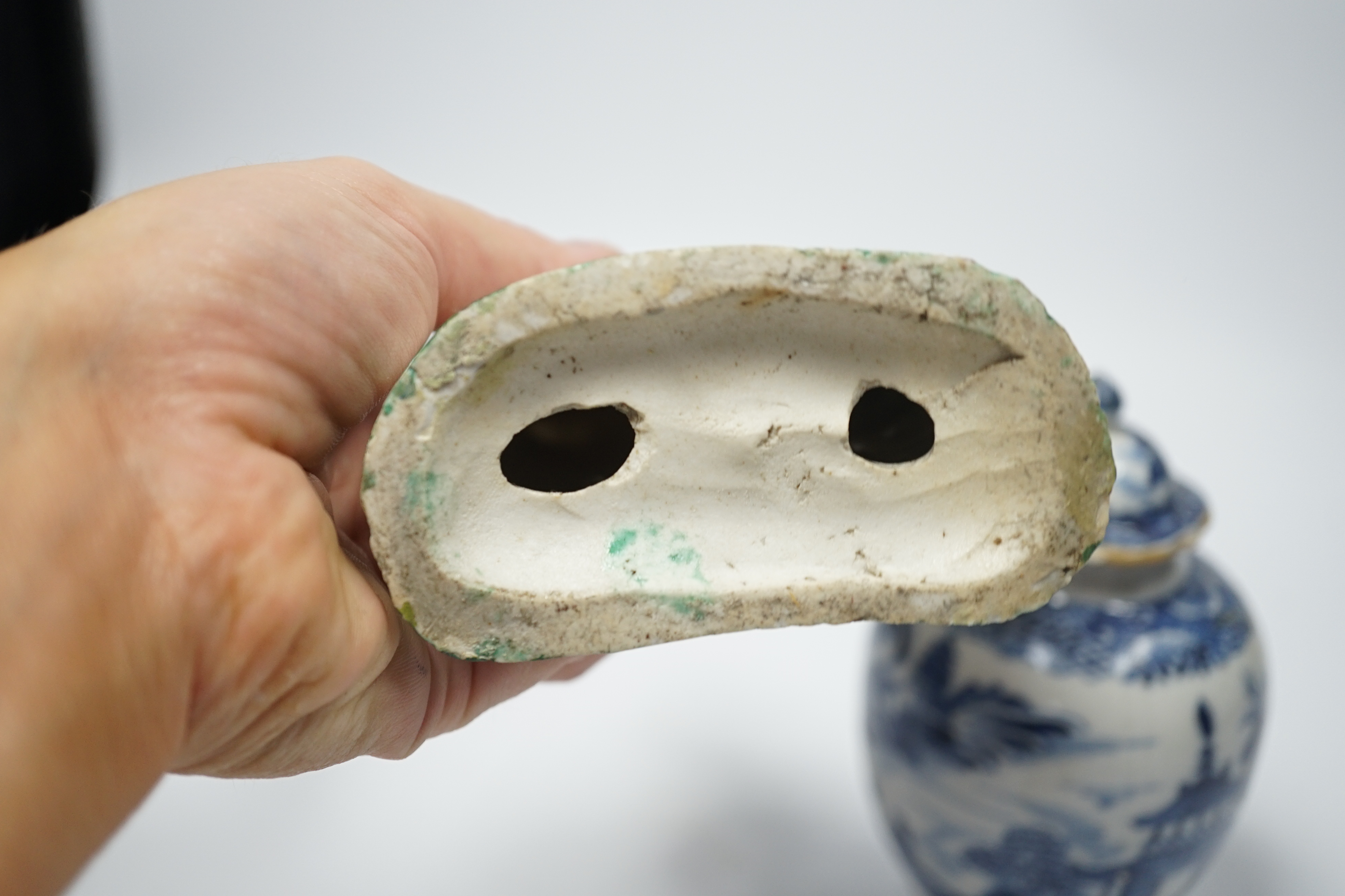 An 18th century Chinese enamelled porcelain figure of a lady standing by rockwork, a similar miniature vase and a blue and white tea caddy and cover, largest 17cm high